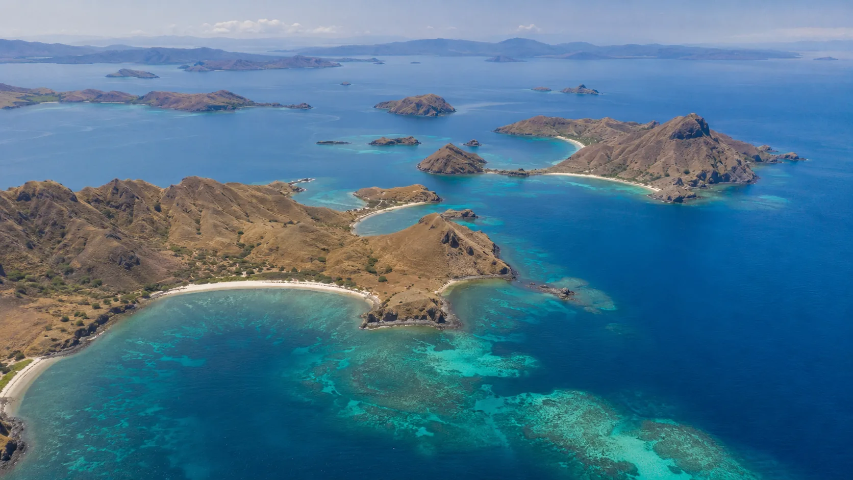 An aerial view over Komodo National Park's islands and reef