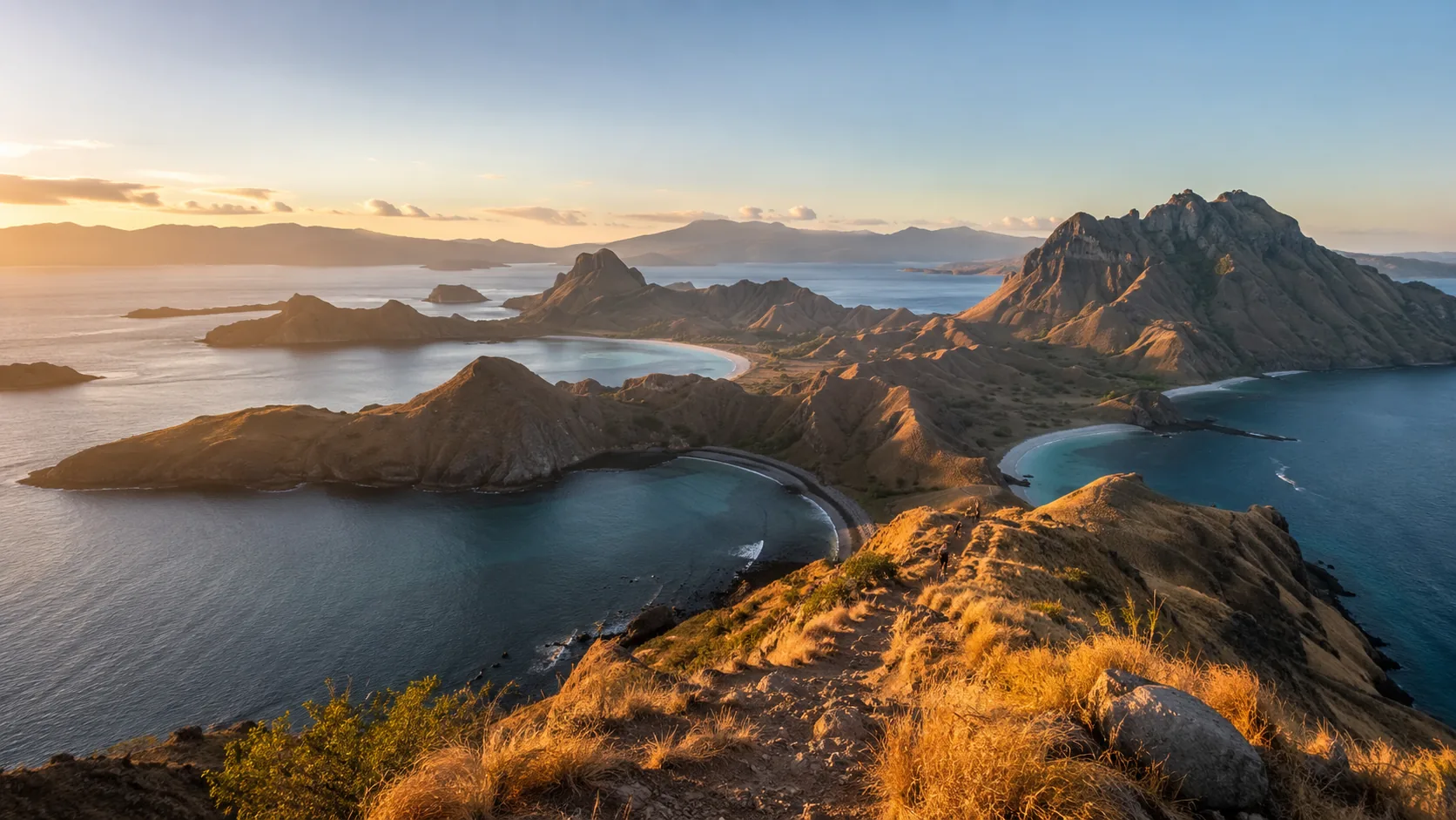 Padar Island's viewpoint ridge overlooking three bays